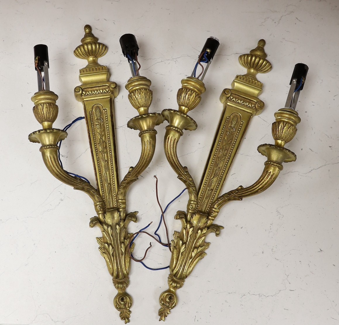 A pair of Adam style neoclassical brass wall sconces, 42.5cm